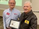 ARRL Roanoke Division Director Dr. Jim Boehner, N2ZZ (left), presents the 2021 Herb S. Brier Instructor of the Year award to Dave Ritter, ND4MR. [Bill Morine, N2COP, photo]
